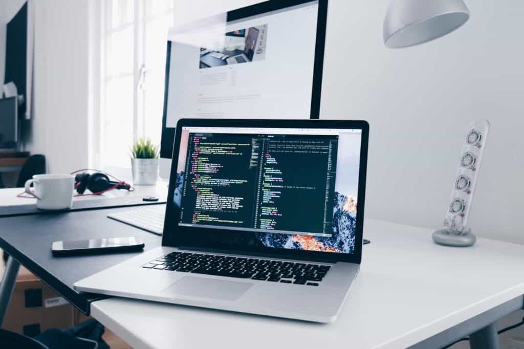 laptop on desk coding
